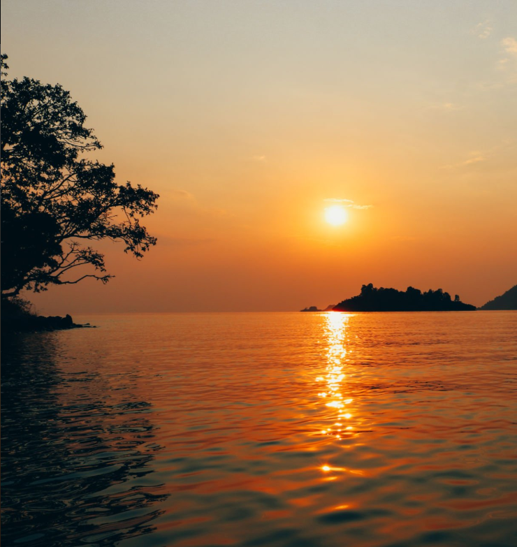 Stunning Lake Kivu sunsets over calm waters with vibrant sky reflections. Sunset photography spots in Kenya?