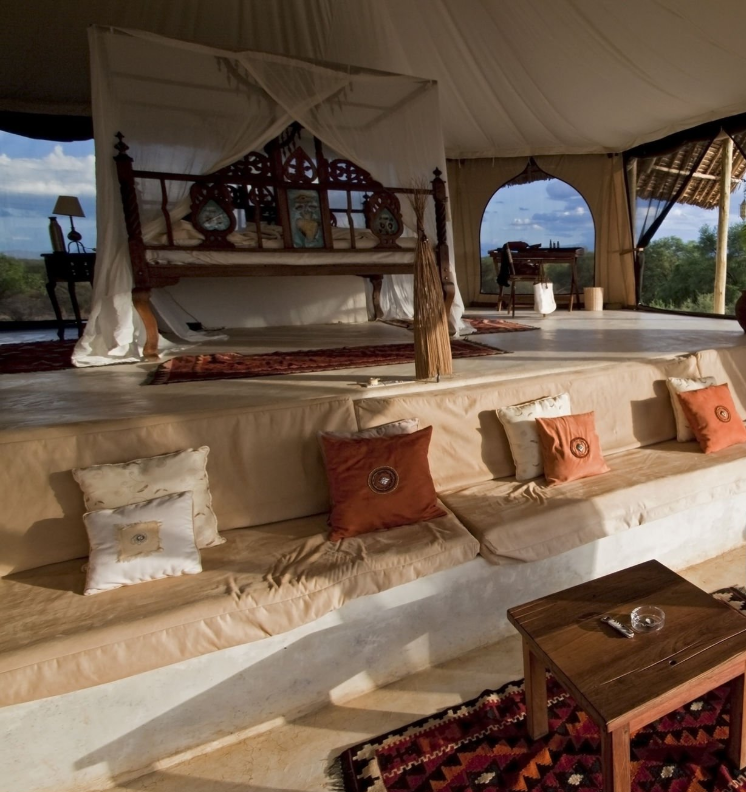 Luxury Tanzania safari lodges amidst Serengeti wilderness at sunset