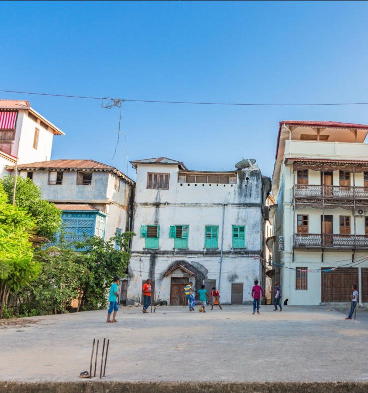 Visit Stone Town Zanzibar: historic doors, bustling markets, and coastal charm