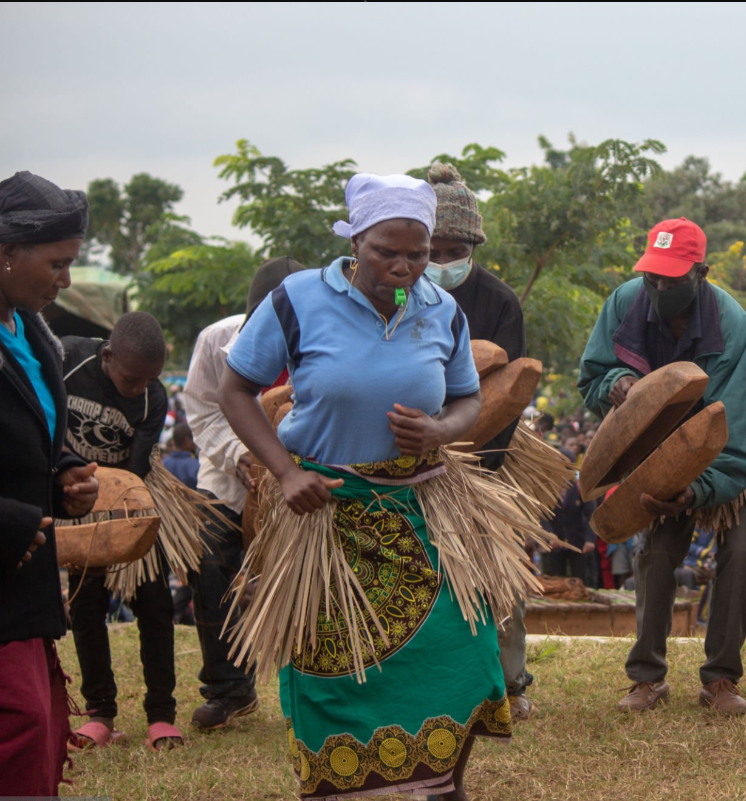 Rwandans participating in Umuganda community service activities together"