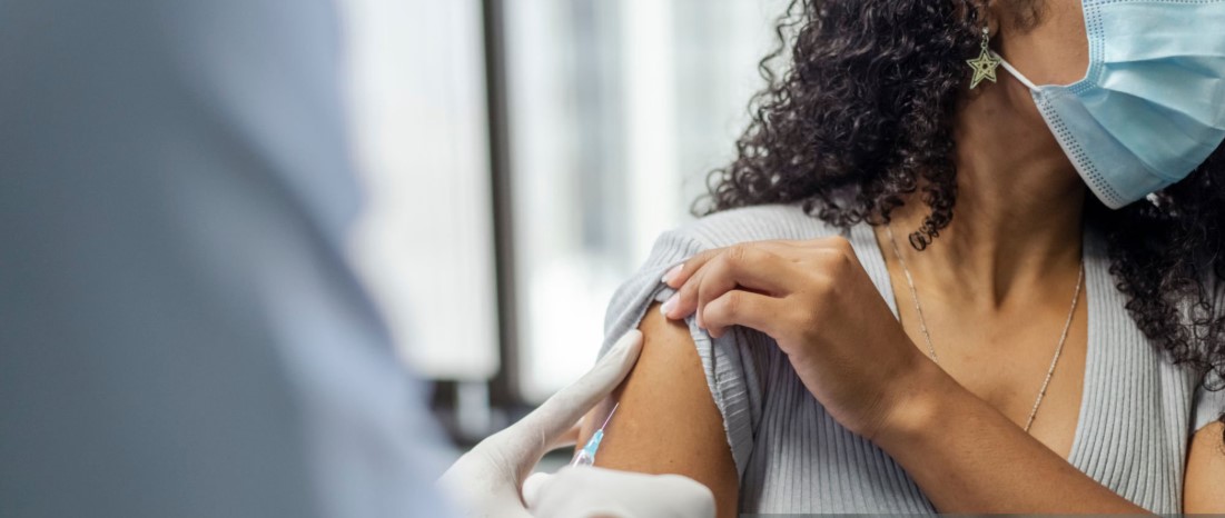 Traveler receiving vaccination before a trip to Tanzania for health and safety.