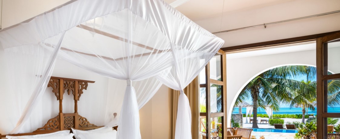 Stunning beach view in Zanzibar with crystal-clear waters and white sandy shores.