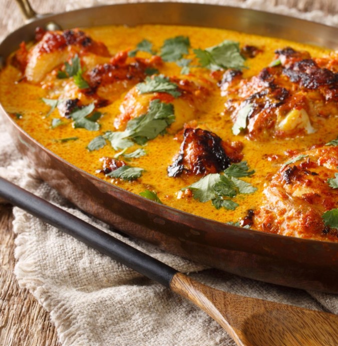 Delicious traditional Zanzibari food prepared during a cooking class, showcasing vibrant colors and aromatic spices.