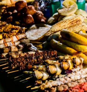 Delicious and vibrant street food served on a busy Tanzanian street stall.
