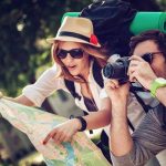 Tourists reading a map in Uganda, relevant to safety for tourists in Uganda