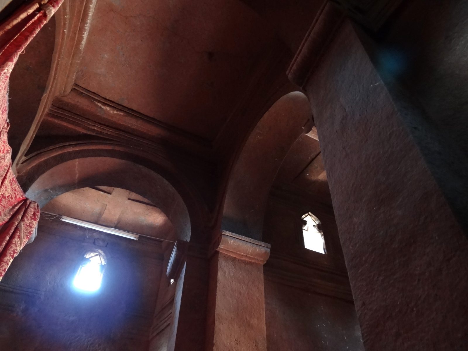 Interior arches carved from rock inside a Lalibela church, Ethiopia