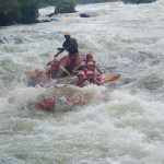 Rafters running the Nile rapids at Bujagali Falls near Jinja, Uganda