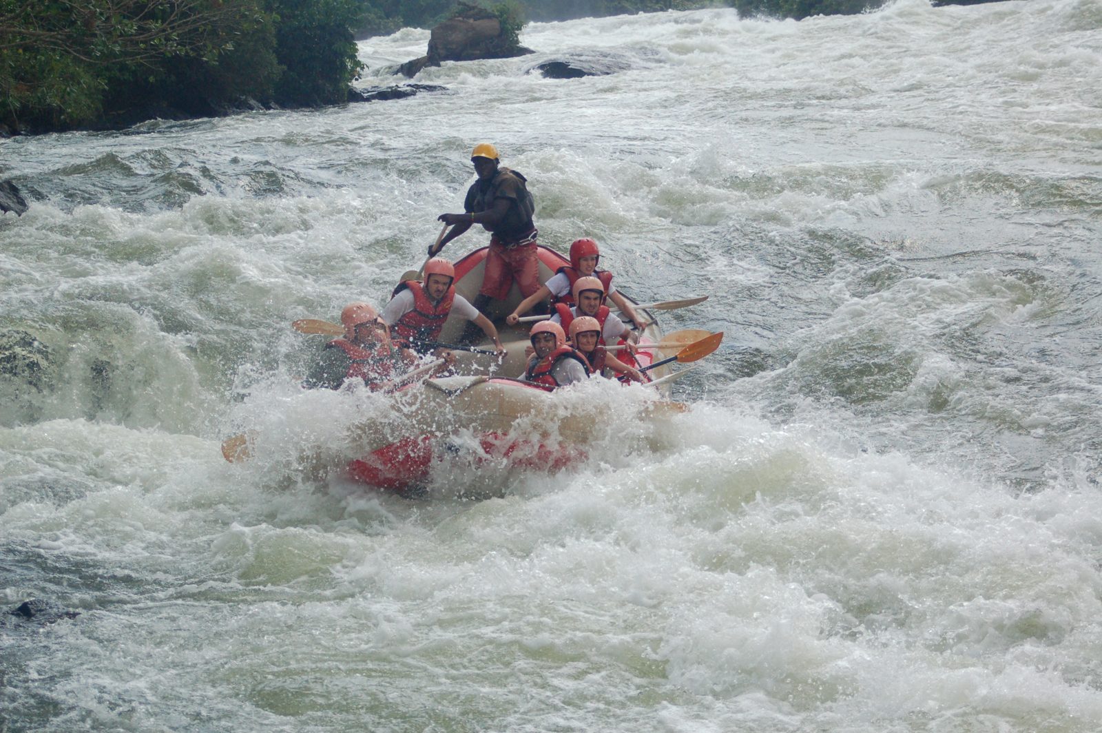 Rafters running the Nile rapids at Bujagali Falls near Jinja, Uganda