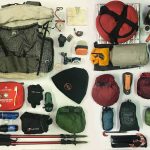 Flat lay of safari packing gear for a Uganda trip